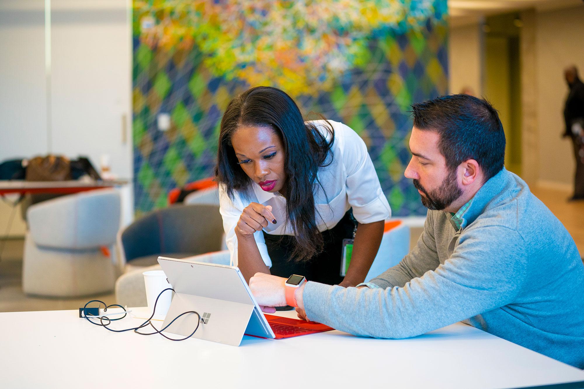 Two people collaborating on a smart solutions project