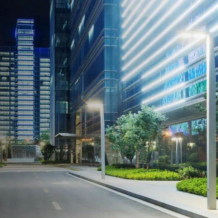 City street at nighttime using smart street light solutions.