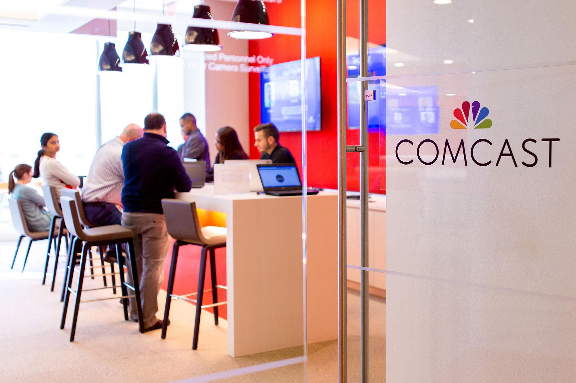 Comcast employees collaborating on connectivity